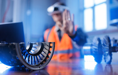 Asian male engineer using AR and VR with AI technology for aerospace component inspection
