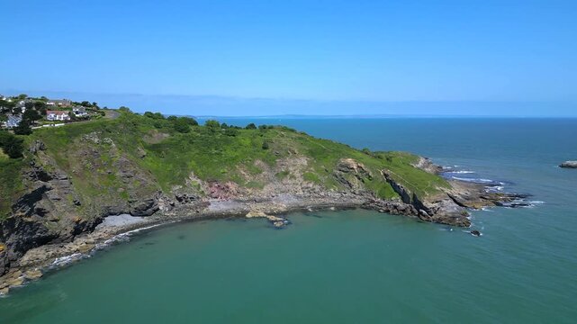 Torbay, South Devon, England: DRONE VIEWS: The drone flies towards the Torbay peninsula&nbsp;known as Hope's Nose. Torbay is a popular UK holiday destination and retirement area (Clip 1 of 2).
