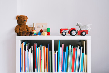 Details of interior decor of children's room with empty white wall. Organizing storage in child's...