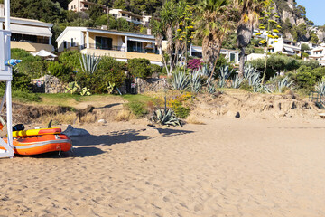 Mediterranean beach resort on a green hillside in Greece