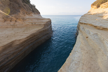 Canal d'amour sea channel rock formation and beach in Corfu, Greece
