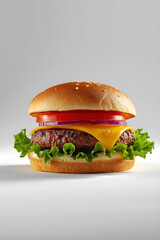 Juicy beef hamburger featuring cheddar, tomatoes, red onion, lettuce, and seeded bun against smooth gradient background
