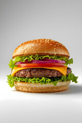 Classic cheeseburger with sesame seed bun, cheddar cheese, and lettuce on white background