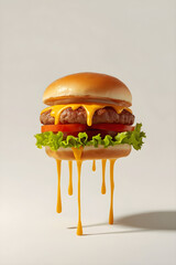 Cheesy burger with melting cheddar, tomato slice and lettuce on off-white background