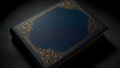 Dark blue leather-bound book with ornate gold corner and border designs on a black surface