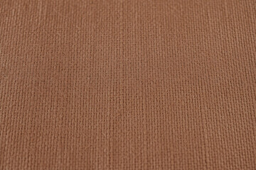 Fototapeta premium Closeup view of a textured brown surface with a subtle vertical pattern