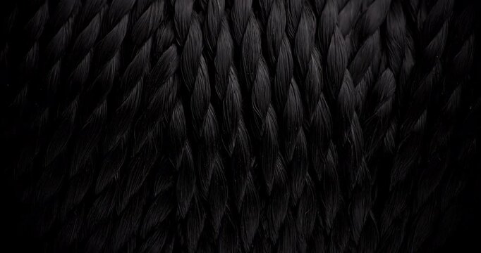 Seamless Woven Texture Background Loop. Texture of Dark rough twine. Video presenting a continuous dark gray woven thread texture.
