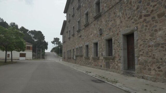 Road gimbal stabilized Cavall Bernat stone house traveling Matadepera overcast