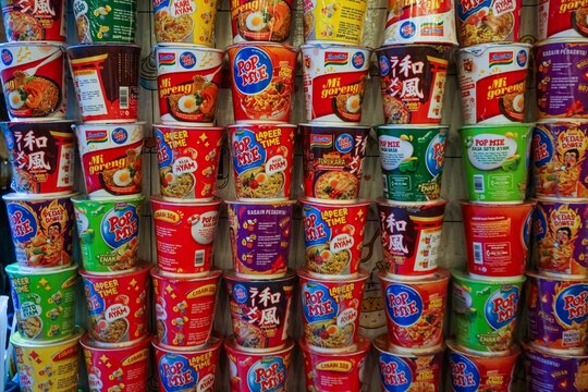 several piles of instant noodles in the shape of a glass at a food stall