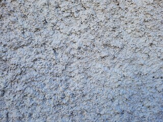 Texture of old rustic wall covered with gray stucco plaster