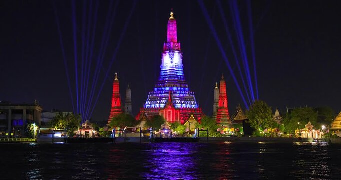 26 November 2025 Beautiful Sunset colours of Thai Temple Wat Arun on Chao Phraya River in BKK Bangkok Thailand. The magic colourful neon light display on the temple at sunset is magical.
