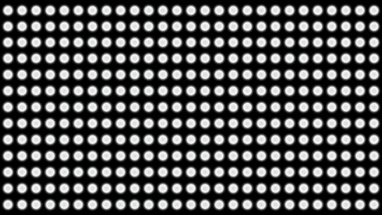 Abstract pattern of white ellipses on a black background
