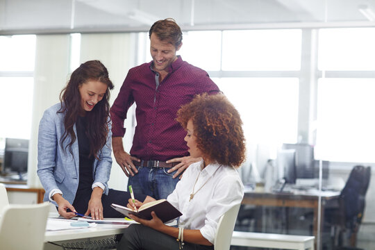 Business, people and talk in meeting with notebook for schedule review, daily plan or collaboration. Happy, team and discussion in office with planner for calendar management, task priority or admin.