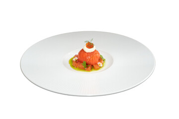 A beautifully plated salmon dish with a garnish. The dish is a fine dining experience, with attention to detail and a focus on presentation