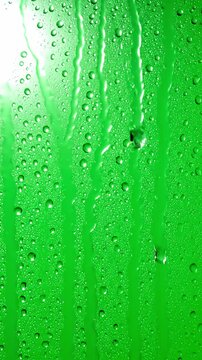 Green Screen rain drops falling down on glass with chroma key background water droplets window scene 3 distortion, overlay, glitch, static noise, scan lines black background, 4k animated video loop