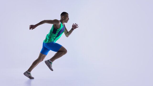 Runner pushing into powerful sprint position. Concept of coaching materials for sprint starts, sports club marketing, athletic performance analysis, and training guide illustrations.