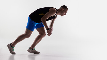 Runner bending forward and checking smartwatch after effort. Concept of fitness-app interfaces, workout summaries, tracking dashboards, and personal running progress tools.