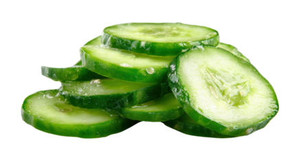 Fresh cucumber slices stacked together on a white isolated background.