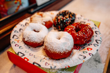 Delicious sweet glazed donuts with powdered sugar