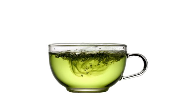 Green tea swirling in a clear glass cup on a white isolated background.