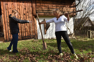 Women in the garden with a shovel