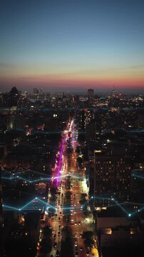 Futuristic smart city with digital data streams and network connections flowing through streets. Night urban landscape with glowing lines