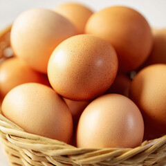 Eggs in Woven Basket: Fresh, brown eggs nestled in a rustic woven basket, a symbol of natural, wholesome goodness and the simple pleasures of the farm. 