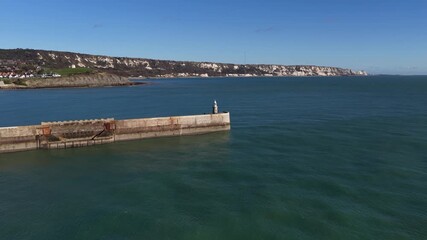 Harbour arm at Folkstone, United Kingdom, pier running in the sea.