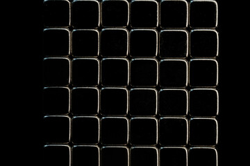 Abstract geometric background of black metallic cubes arranged in a grid. Shiny dark square texture pattern for modern technology design and minimalist wallpaper. Photo