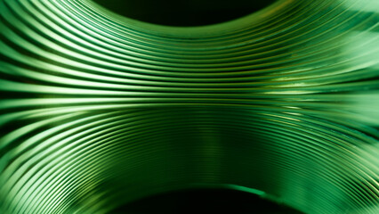 Abstract green metal spiral lines background. Macro view of shiny spring coil texture looking like a futuristic tunnel, wave, or data flow structure. Photo