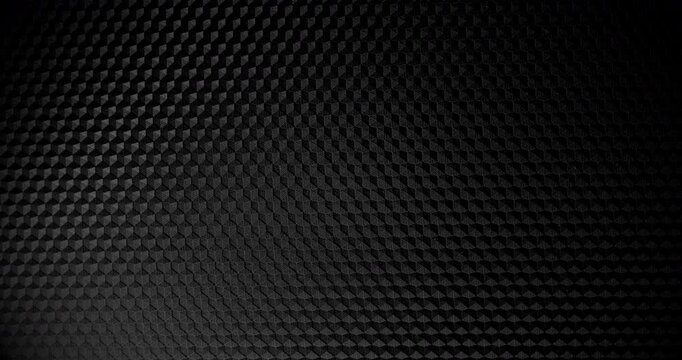Carbon Texture. Close-up of premium black carbon fiber weave with subtle light shift, creating a high-tech, endlessly background.