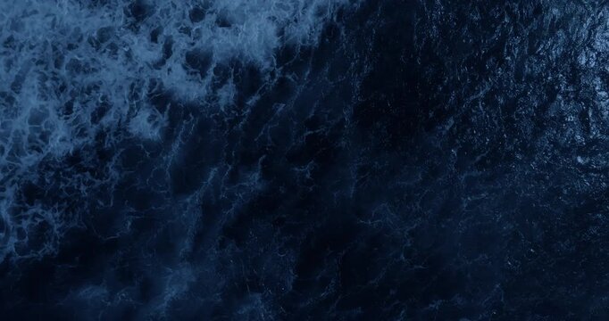 Top view of ocean waves at night. Power of ocean concept