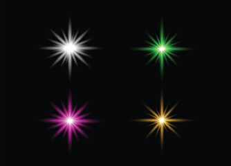 Fototapeta premium Four colorful starbursts glowing on a black background