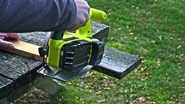 Efficient cutting techniques for outdoor projects using a cordless handheld saw