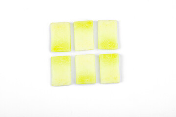 Geometric pattern of fresh melon pieces cut into squares, circles, triangles. Abstract food design