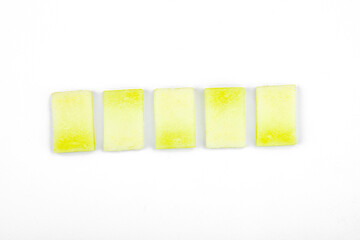 Geometric pattern of fresh melon pieces cut into squares, circles, triangles. Abstract food design