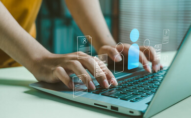digital HR technology concept image showing hands typing on a laptop with virtual profile icons, symbolizing online recruitment, employee management, data processing, modern human resource solutions.