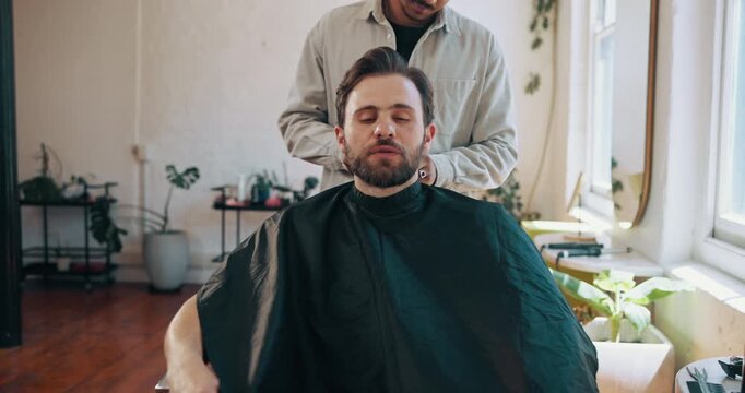 Barbershop, appointment and man with barber, haircare and bib for hair maintenance, talk or haircut. Salon, hairdresser and people with protective cape for hairstyle, smile and discussion with client
