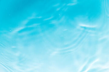 Obraz premium Macro blue water wave texture,Banner of Blue Abstract water background texture with ripples and waves,Blue macro water wave texture and circles.