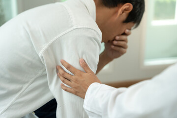 psychiatrist holds shoulders while discussing life and family issues. doctor encourages and empathy...