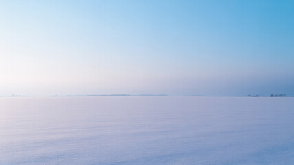 Snow field under blue sky horizon