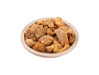 Fried pork cracklings on a plate isolated over white background