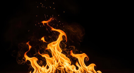 Vibrant and intense orange flames flicker dynamically, casting a warm glow against a dark black background with ample copy space for text.