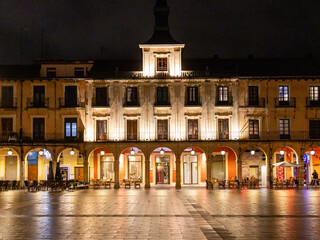 Views of the main square of Leon with people strolling peacefully along its sidewalks