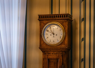 The old and vintage clock  in a room