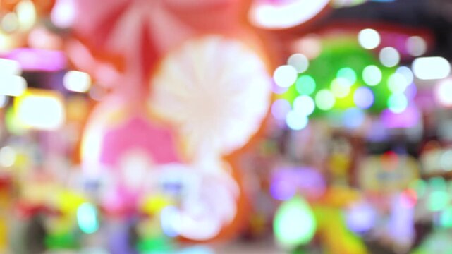 Blurred Colorful arcade zone with vibrant blurred lights and playful ambience in shopping mall, Indoor Playground, Game Zone, Kids Playpark, creating a lively and energetic entertainment atmosphere