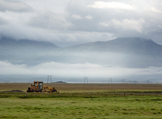 mountains, tractor and landscape in Iceland