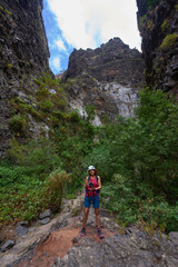 Fototapeta premium Happy hiker in dramatic canyon