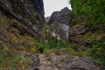 Trail through narrow volcanic gorge