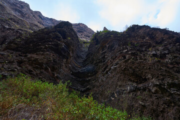 Deep volcanic gorge with towering walls